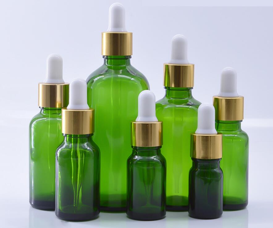 green essential oil bottles 